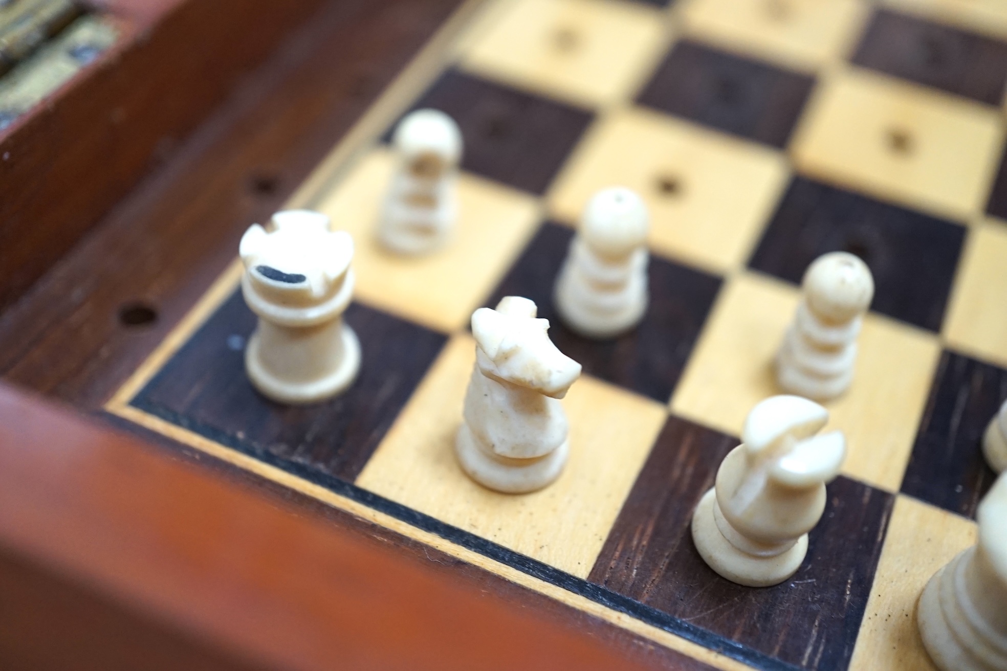 Two In Statu Quo type travelling chess sets, one with bone pieces, the other plastic. Condition - fair to good